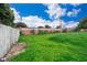 Large grassy backyard with wooden fence at 901 S Solandra Dr, Orlando, FL 32807