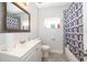 Clean bathroom with shower/tub combo, vanity, and updated fixtures at 901 S Solandra Dr, Orlando, FL 32807
