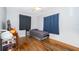 Bright bedroom featuring hardwood floors and ample natural light at 901 S Solandra Dr, Orlando, FL 32807