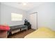 Bedroom with two twin beds, window, and wood flooring at 901 S Solandra Dr, Orlando, FL 32807