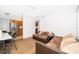 Living room with brown sectional sofa and wood floors at 901 S Solandra Dr, Orlando, FL 32807