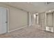 Upstairs hallway with carpet and doors to bedrooms at 984 Desert Candle Dr, Ocoee, FL 34761