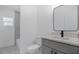 Simple bathroom with gray vanity and single sink at 13497 Se 100Th Ave, Belleview, FL 34420