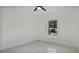 Bright bedroom with ceiling fan and window at 13497 Se 100Th Ave, Belleview, FL 34420