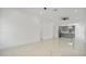 Open concept living room with views into the kitchen at 13497 Se 100Th Ave, Belleview, FL 34420