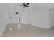 Bright living room featuring tile floors and ceiling fans at 13497 Se 100Th Ave, Belleview, FL 34420