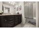 Bathroom with double vanity and bathtub at 1366 Lava Tree Dr, Davenport, FL 33897