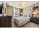 Charming bedroom with a queen bed, stylish decor, and a wall-mounted TV at 1366 Lava Tree Dr, Davenport, FL 33897