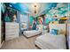 Two twin beds in a themed bedroom with Disney princess mural at 1366 Lava Tree Dr, Davenport, FL 33897