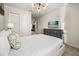 Bedroom with a queen bed, TV, and dresser at 1366 Lava Tree Dr, Davenport, FL 33897