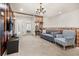 Upstairs hallway with a sitting area and doors to bedrooms at 1366 Lava Tree Dr, Davenport, FL 33897