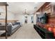 Spacious living area with a library-themed wall and comfortable seating at 1366 Lava Tree Dr, Davenport, FL 33897