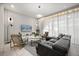 Living room with contemporary furniture and a large flat-screen TV at 1366 Lava Tree Dr, Davenport, FL 33897