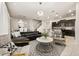 Open living space with a contemporary sectional sofa and modern coffee table at 1366 Lava Tree Dr, Davenport, FL 33897