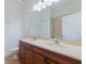 Double vanity bathroom with shower and tile floors at 13730 Lensdale Ln, Windermere, FL 34786