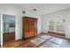 Bright bedroom with wood floors and large closet at 13730 Lensdale Ln, Windermere, FL 34786