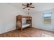 Bedroom with a bunk bed and wood floors at 13730 Lensdale Ln, Windermere, FL 34786