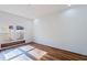 Bright bedroom with hardwood floors and large window at 13730 Lensdale Ln, Windermere, FL 34786