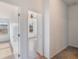 Hallway with doors to bedrooms and carpet at 13730 Lensdale Ln, Windermere, FL 34786