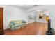 Living room with hardwood floors and view into kitchen at 13730 Lensdale Ln, Windermere, FL 34786