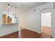 Living area with hardwood floors and access to another room at 13730 Lensdale Ln, Windermere, FL 34786