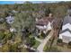 Aerial view of a two story home with driveway and landscaping at 141 Oakwood Way, Winter Park, FL 32789