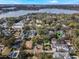 Aerial view of a house community near a lake, showcasing the property's location and surrounding landscape at 141 Oakwood Way, Winter Park, FL 32789