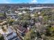 Aerial view of home and neighborhood with lake in background at 141 Oakwood Way, Winter Park, FL 32789