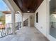 Covered balcony with tile flooring, ceiling fan, and French doors at 141 Oakwood Way, Winter Park, FL 32789