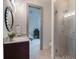 Bathroom with a walk-in shower and a vanity at 141 Oakwood Way, Winter Park, FL 32789