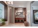 Vanity with wood cabinets, marble countertop and a glass shower at 141 Oakwood Way, Winter Park, FL 32789