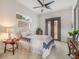 Bright bedroom featuring neutral colored walls, carpet and furniture, a ceiling fan and an exterior door at 141 Oakwood Way, Winter Park, FL 32789