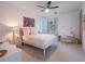 Bright bedroom with a comfortable bed and workspace at 141 Oakwood Way, Winter Park, FL 32789