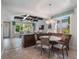 Open concept dining area with round table and built in bench at 141 Oakwood Way, Winter Park, FL 32789