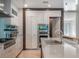 Modern kitchen with stainless steel appliances and white cabinetry at 141 Oakwood Way, Winter Park, FL 32789