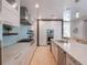 Modern kitchen with stainless steel appliances and white cabinetry at 141 Oakwood Way, Winter Park, FL 32789
