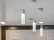 Modern kitchen with sleek pendant lighting and cabinetry at 141 Oakwood Way, Winter Park, FL 32789