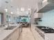 Bright kitchen with island, breakfast nook, and stainless steel appliances at 141 Oakwood Way, Winter Park, FL 32789