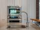 Modern kitchen sink and faucet with marble countertop at 141 Oakwood Way, Winter Park, FL 32789