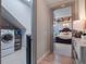 Convenient laundry room with washer, dryer, and storage at 141 Oakwood Way, Winter Park, FL 32789