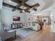 Living room with hardwood floors, coffered ceiling, and comfortable seating at 141 Oakwood Way, Winter Park, FL 32789