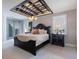 Large main bedroom with double doors and a unique ceiling design at 141 Oakwood Way, Winter Park, FL 32789