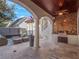 Outdoor kitchen and patio with built-in grill and seating area at 141 Oakwood Way, Winter Park, FL 32789