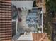 Aerial view of a relaxing patio with seating area and fire pit at 141 Oakwood Way, Winter Park, FL 32789
