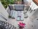 Relaxing patio with water feature, seating area, and stone flooring at 141 Oakwood Way, Winter Park, FL 32789