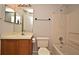 Neutral bathroom featuring a single vanity, tile floors, and a shower and tub combo with an updated shower head at 144 Reserve Cir # 112, Oviedo, FL 32765