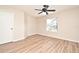 This bedroom has wood floors and a window to let in natural light at 144 Reserve Cir # 112, Oviedo, FL 32765