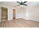 The bedroom features wood floors and an attached bathroom at 144 Reserve Cir # 112, Oviedo, FL 32765