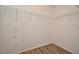 Walk-in closet features wood floors and metal shelving at 144 Reserve Cir # 112, Oviedo, FL 32765