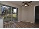 Bright dining area with wood floors and sliding glass doors to the lanai at 144 Reserve Cir # 112, Oviedo, FL 32765